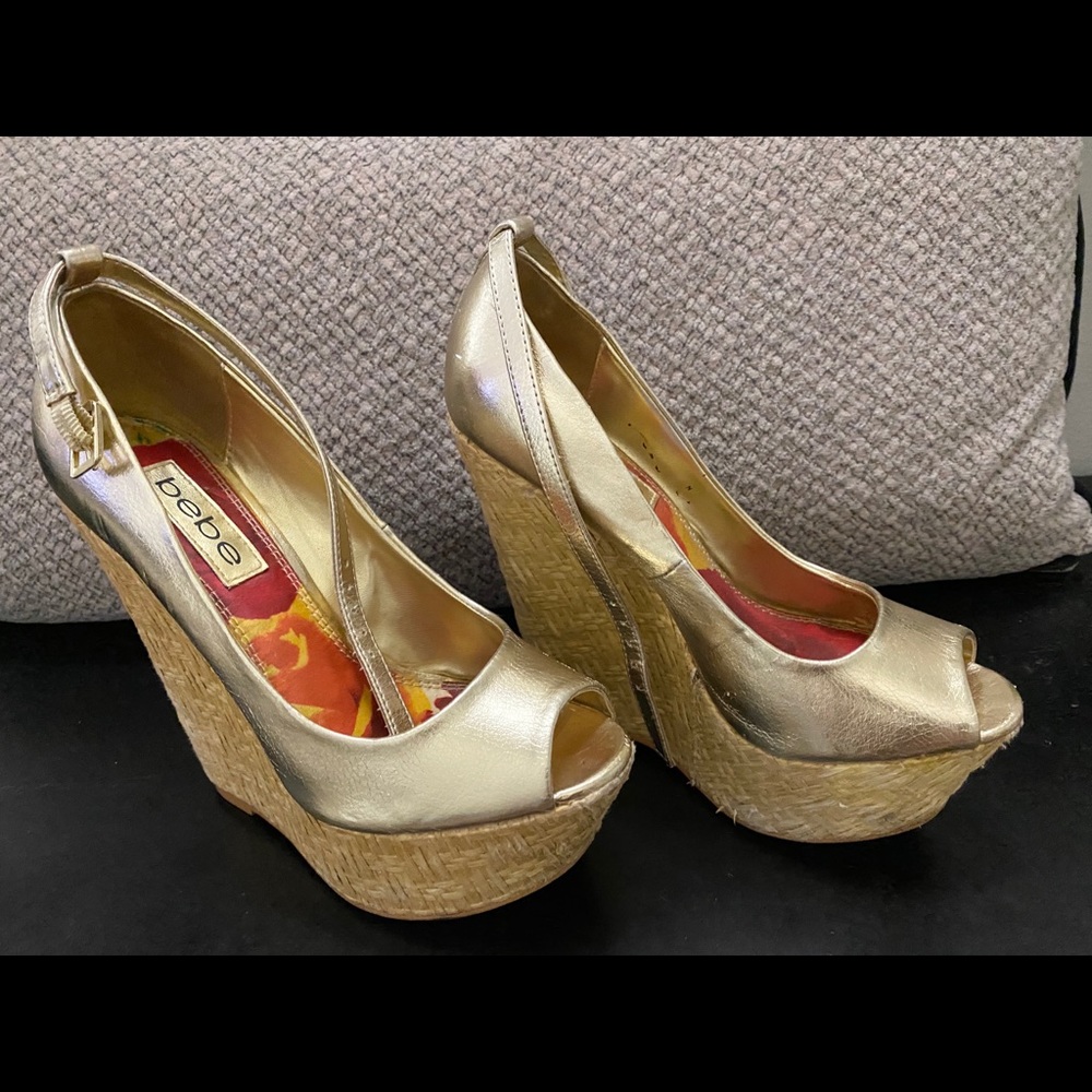 Platform wedge gold espadrilles.